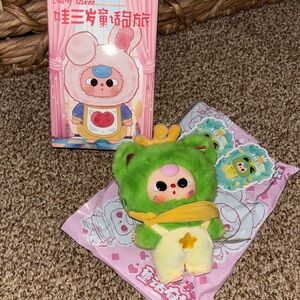 Green and Yellow Plush Toy with Crown